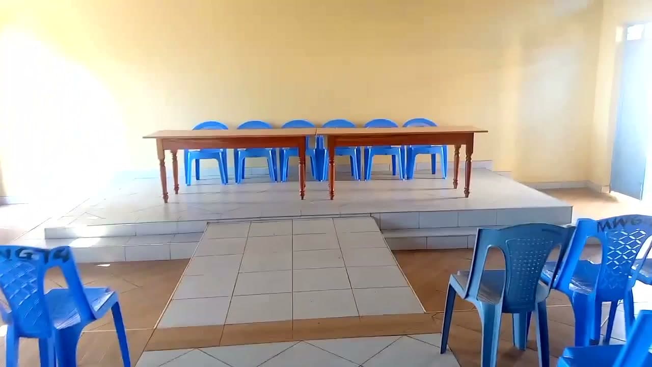 The head table on the tiled raised platform